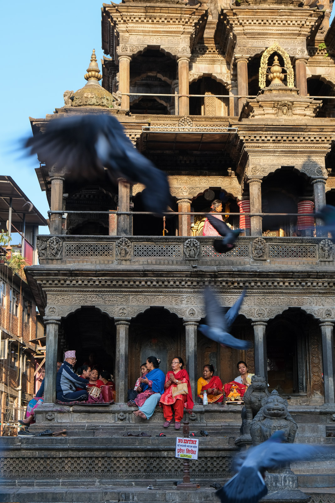 Nepali sitting in temple=
