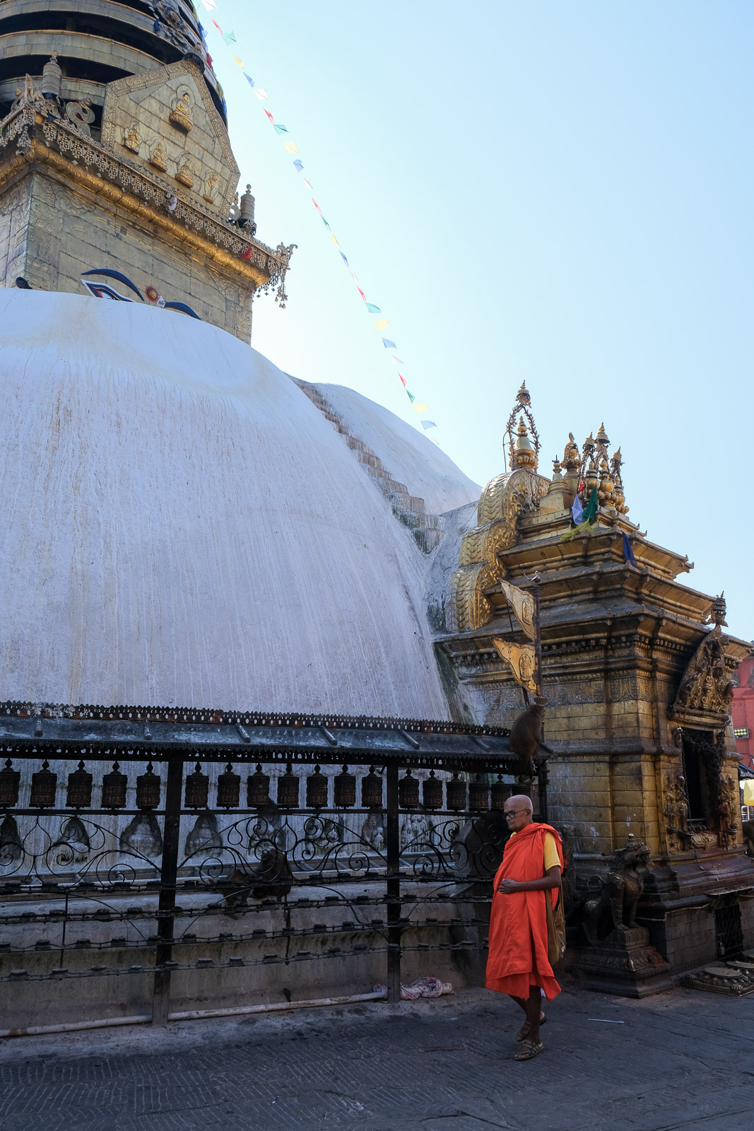 Monk walking around stupa=