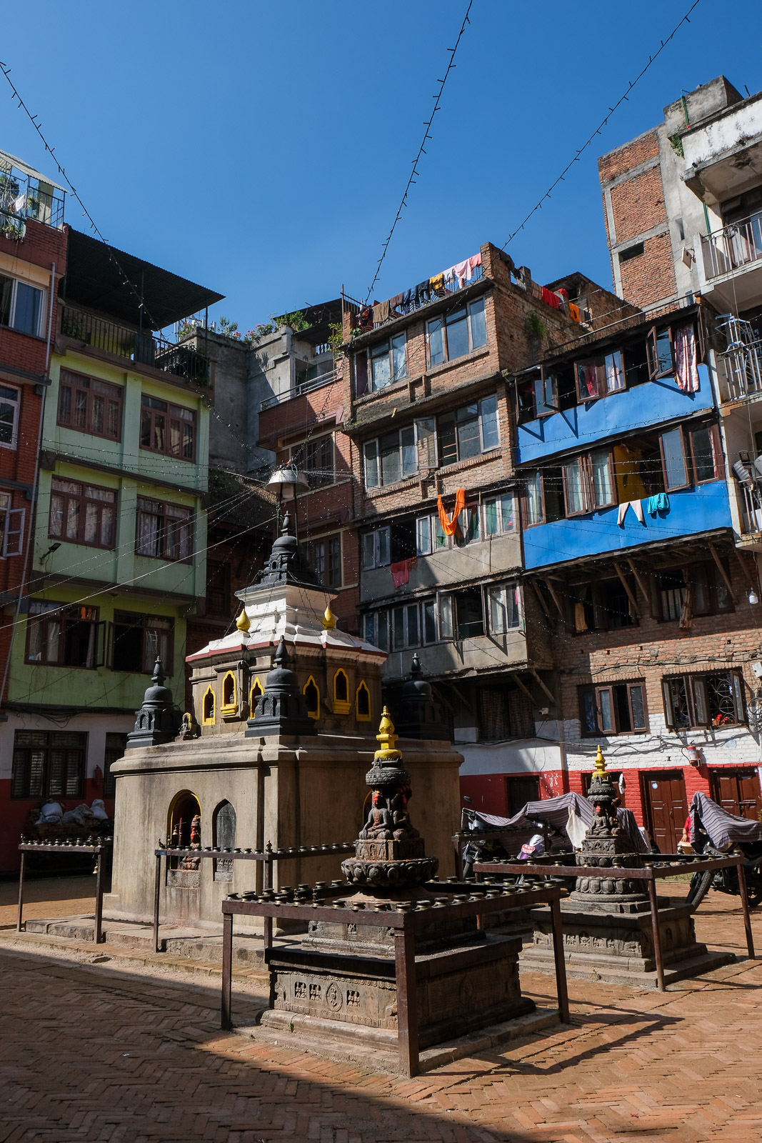 Stupa between buildings=
